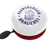 Fahrradklingel in Rot, Weiß und Blau mit Schriftzug „Flensburger Brauerei“ und einem Schiff als Logo auf der weißen Oberfläche.
